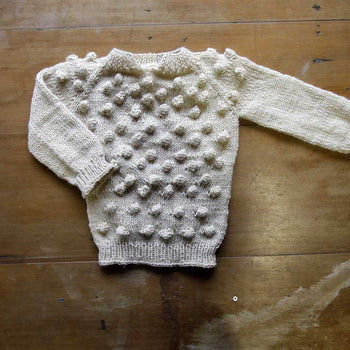 Chomba niño de lana de oveja tejida a palillos